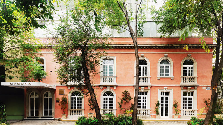 The Casona Roma Norte's grand mansion, or casona, is a protected historical building, down to its signature pink exterior.
