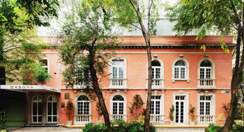 The Casona Roma Norte's grand mansion, or casona, is a protected historical building, down to its signature pink exterior.