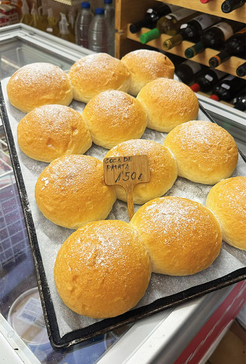A tray of freshly baked coca de patata. A tray of freshly baked coca de patata.