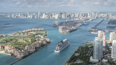 A cruise ship sails into PortMiami, the world's busiest cruise port.