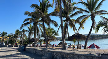 Barra de Navidad has a small marina and a malecon, where travelers can catch beautiful sunsets in the evening.