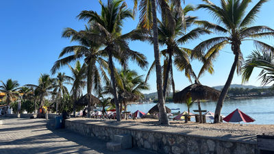 Barra de Navidad has a small marina and a malecon, where travelers can catch beautiful sunsets in the evening.