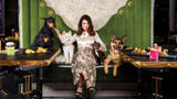 Lisa Vanderpump poses with a few canine friends at the Vanderpump Cocktail Garden at the Caesars Palace Las Vegas.