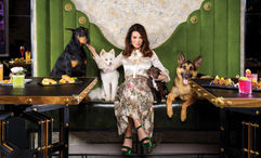 Lisa Vanderpump poses with a few canine friends at the Vanderpump Cocktail Garden at the Caesars Palace Las Vegas.