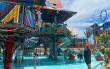 The Rush Out Gush Out water play area features structures inspired by communal Junkanoo shacks.